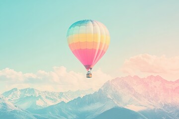 Obraz premium Hot air balloon over misty mountains at sunrise