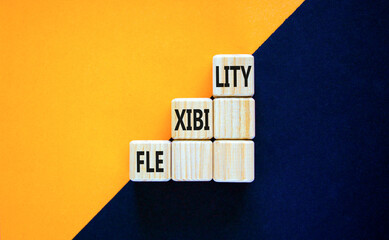 Flexibility symbol. Concept word Flexibility on beautiful wooden cubes. Beautiful orange black...