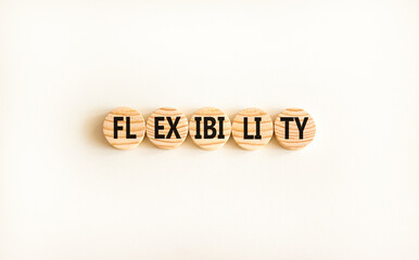 Flexibility symbol. Concept word Flexibility on beautiful wooden circles. Beautiful white...