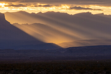 Sierra Del Carmen Mountains Silhouetted In The Fog And Morning Rays In Big Bend