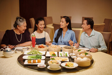 Asian family having meeting in the restaurant