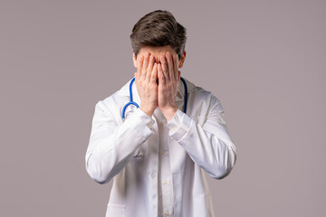 Disappointed doctor man doing facepalm. Feeling regret, failure, dissatisfaction, wasted time