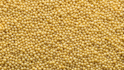 Fototapeta premium Yellow mustard seeds background for culinary and nutrition concepts with copy space