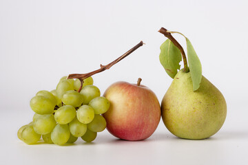 grapes, apple, pear on a white background, fresh harvest