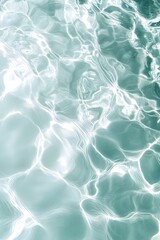 Fototapeta premium A shot from above featuring a light green and white background with water ripples and a light blue background.