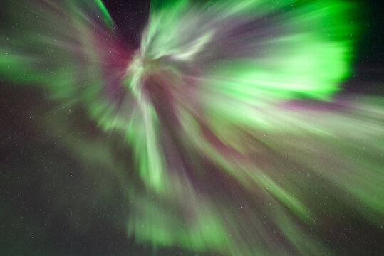 Beautiful green, red, pink and purple northern lights, crown, aurora borealis, auroral corona taken in Troms, Norway - Powered by Adobe