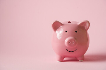 Cute pink piggy bank, close up view.