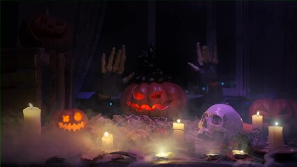 Carved pumpkin Jack o'lantern fast waves skeletal hands in fog, inviting you to join a spooky Halloween party. 