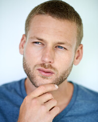 Obraz premium Ideas, thinking and face of man in studio with casual fashion, confidence and creative inspiration. Remember, decision and young professional with choice, cool style or reflection on white background