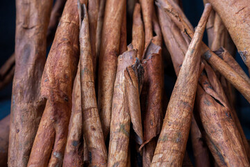 Close up of dried cinnamomum cassia. Some cinnamon bark being dried in the sun.