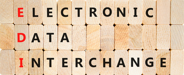 EDI electronic data interchange symbol. Concept words EDI electronic data interchange on blocks on a beautiful wooden background. Business and EDI electronic data interchange concept. Copy space.