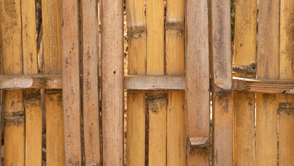Native Thai Style Bamboo wall background. Home yard fence made of woven bamboo.