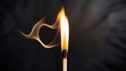 burning match on black background