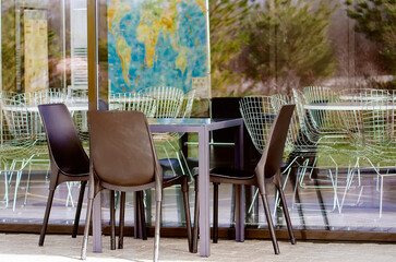 Modern table and chairs in a street cafe.