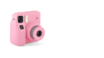 Closeup of pink instant photographic camera, isolated on white copy-space background.
