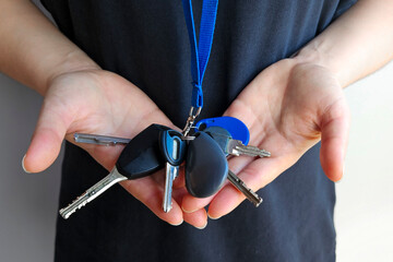 A bunch of keys in hand. Easy access and convenient key holder for everyday carry.
