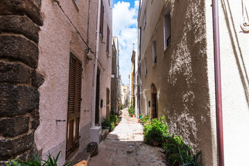 Street photography, beautiful alley of Castelsardo old city - Sardinia - Italy.