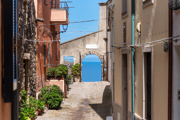Street photography, beautiful alley of Castelsardo old city - Sardinia - Italy.