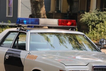 Police car with overhead flashing lights