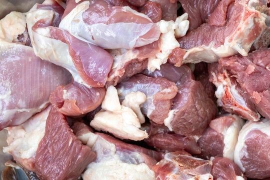 Fresh raw mutton pieces texture background.