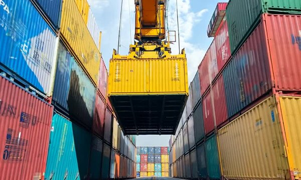 Container Crane Lifting a Cargo Container at a Port
