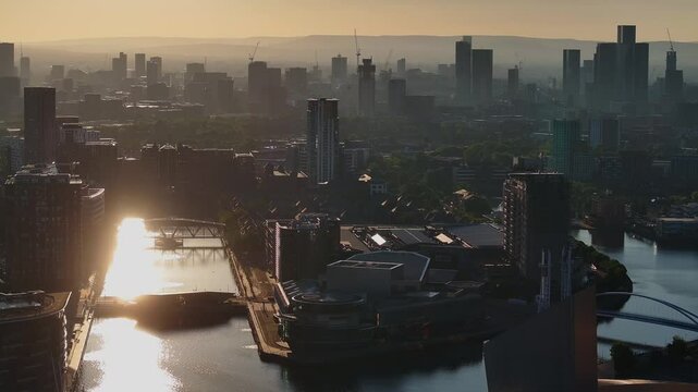 Manchester and Salford city skyline during sunriseover the Deansgate Square Complex including the towers The Blade, Thre60, North,West,East,South deansgate towers, Manchester