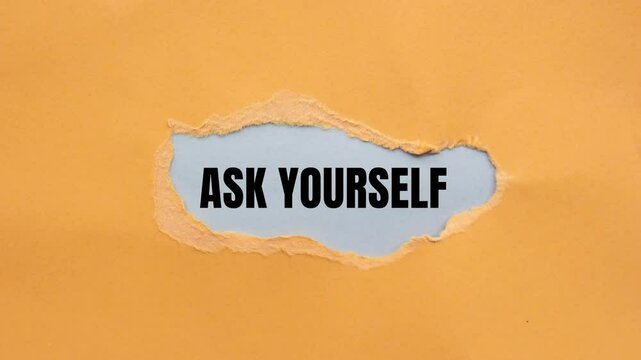 Ask yourself message writing on ripped torn orange paper on gray background. Conceptual ask yourself symbol.