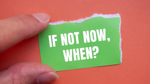 If not now, when question writing on ripped torn green paper piece on orange background. Conceptual if not now when question symbol.