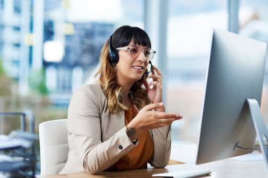 Business woman, computer and web consultation talk with customer support and headphones at call center. Office, crm and telemarketing consultant with internet advice and help desk with online agent