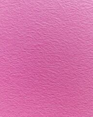 Fototapeta premium Close-up view of textured pink paper showing intricate patterns and color variations