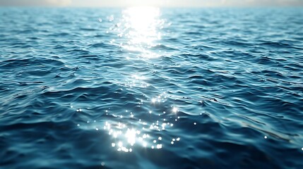 A serene view of shimmering water reflecting sunlight, creating a tranquil atmosphere.