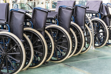 Obraz premium Wheelchairs lined up inside the airport in Catania, Italy. Concept of mobility and accessibility.