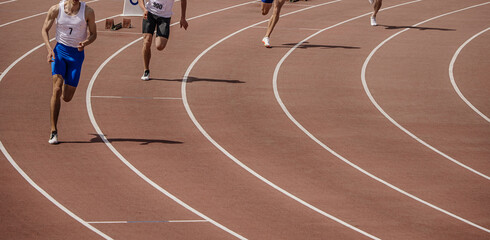 start group of athletes sprint race at stadium, athletics competition