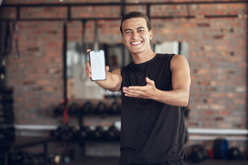 Phone, screen and portrait of man in gym for fitness app, membership or offer to download. Happy, person and point at tech with mockup space for exercise program, training or online registration info