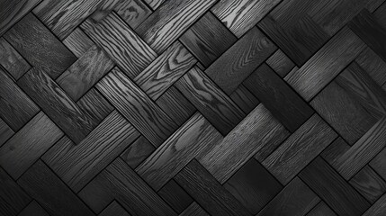 The top-down perspective highlights the elegant herringbone pattern of a dark grey parquet wood floor, showcasing its rich texture and craftsmanship, perfect for modern interiors