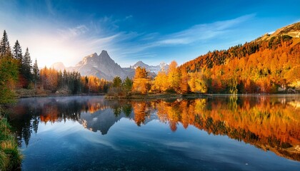 Fototapeta premium Serene Autumn Mountain Landscape with Reflective Lake and Vibrant Foliage at Sunrise