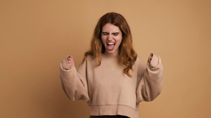 Woman shouting in rage looking at camera