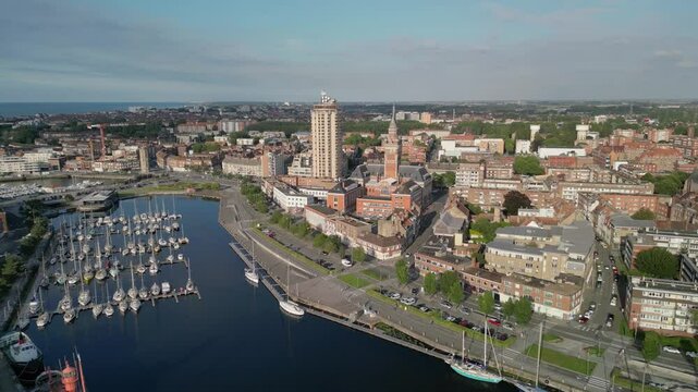 The drone aerial footage of Marina Port du Commerce and the tower of the townhall, Dunkirk, France. Dunkirk is a commune in the department of Nord in northern France.