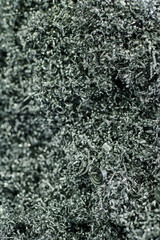 Close-up view of tangled industrial metal shavings and curly strands arranged densely capturing intricate textures and metallic details conveying industrial and manufacturing focus