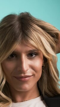 Happy transgender businesswoman playing with hair and puckering lips