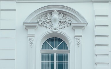 An ivory plaster relief depicting a floral design.