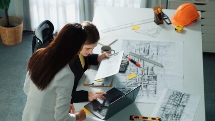 Top view of smart business woman talking and give house design. Aerial view of architect engineer...