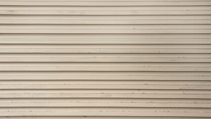 Old cream metal roller shutter door. Line pattern texture background. Aluminum doors. Old gray metal roller shutter door background texture.