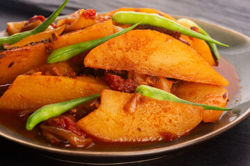 fried potatoes with paprika sauce. crispy fried patata bravas, fried potatoes with smoked paprika sauce
