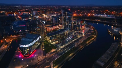 Fototapeta premium Drone view of Media city Salford quays at night, Manchester