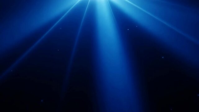 Blue light beams on black background. Bright optical lens flares effect. Spotlight rays abstract animation. Dynamic video footage. Atmospheric lighting
