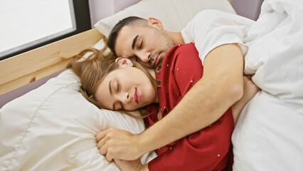 A serene man and woman lovingly embrace, asleep in a cozy bedroom interior, depicting a tranquil couple moment.