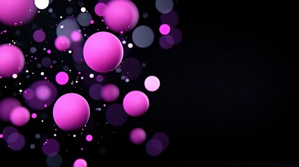   A black backdrop with several pink balls suspended in mid-air