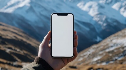 Modern Connectivity: Holding a Mobile Phone with Mountain View Background