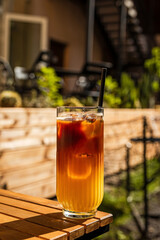 Bumble cold coffee drink, espresso and orange juice, on the terrace of a cafe